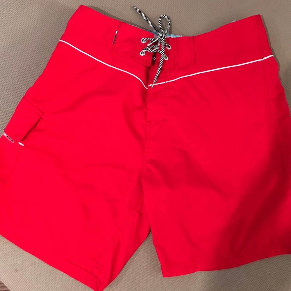 Red swim suit trunks size 32